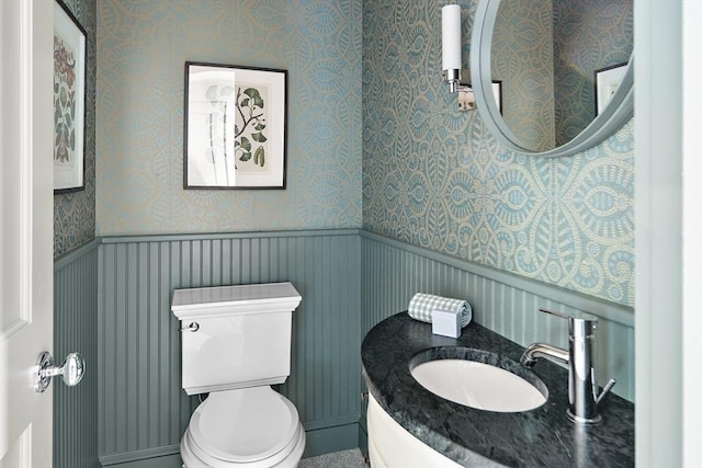 14 Dodges Row, Wenham, MA 01984 - half bathroom featuring toilet, vanity, and wallpapered walls