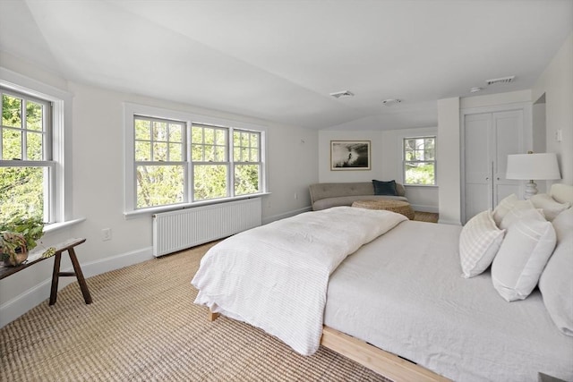 14 Dodges Row, Wenham, MA 01984 - bedroom with radiator, multiple windows, baseboards, a closet, and lofted ceiling