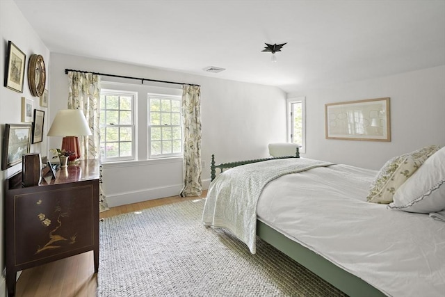 14 Dodges Row, Wenham, MA 01984 - bedroom featuring multiple windows, wood finished floors, and baseboards