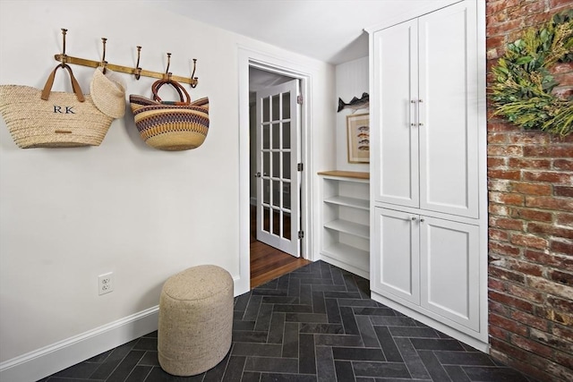 14 Dodges Row, Wenham, MA 01984 - mudroom with baseboards and brick patterned flooring