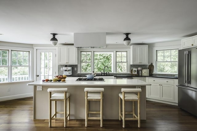 14 Dodges Row, Wenham, MA 01984 - kitchen featuring high quality fridge, a kitchen island, decorative backsplash, and healthy amount of natural light