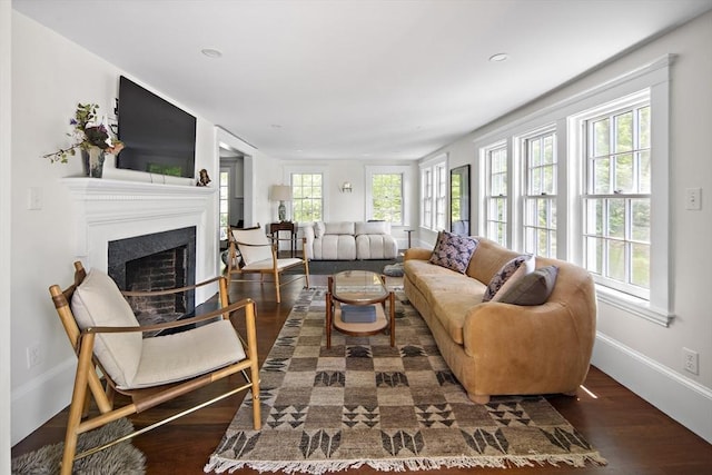 14 Dodges Row, Wenham, MA 01984 - living area with wood finished floors, plenty of natural light, a fireplace, baseboards, and recessed lighting