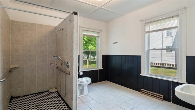 14 Maple St, Amesbury, MA 01913 - full bathroom featuring toilet, wainscoting, and tiled shower