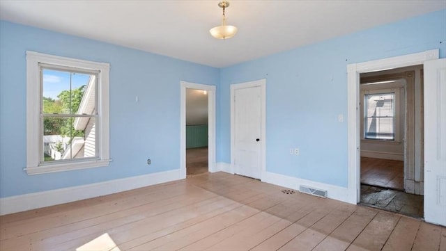 14 Maple St, Amesbury, MA 01913 - unfurnished room with wood-type flooring and baseboards