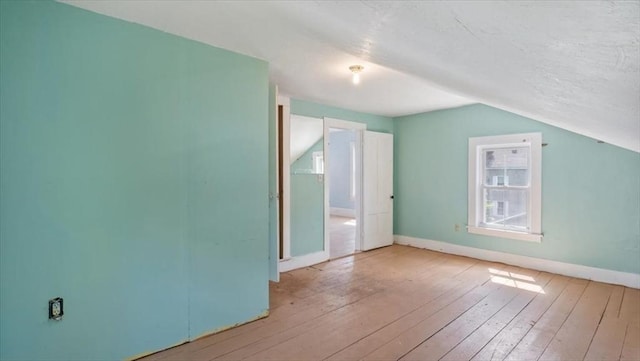 14 Maple St, Amesbury, MA 01913 - bonus room featuring lofted ceiling, baseboards, hardwood / wood-style flooring, and plenty of natural light