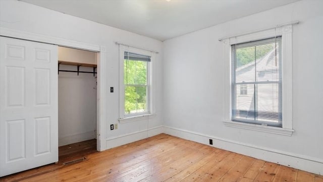 14 Maple St, Amesbury, MA 01913 - unfurnished bedroom with hardwood / wood-style floors, baseboards, and a closet