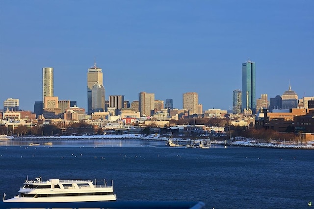 property's view of city featuring a water view