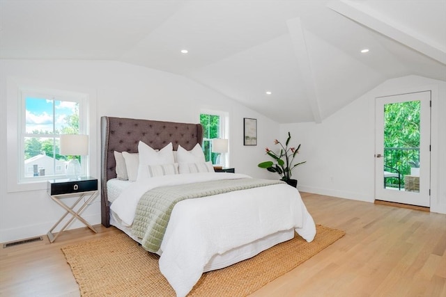 bedroom with vaulted ceiling, access to exterior, light hardwood / wood-style floors, and multiple windows