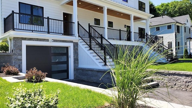 property entrance with covered porch and a garage