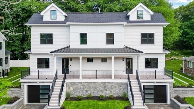 view of front of property with a front yard and a porch