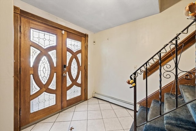 tiled entryway featuring a baseboard radiator