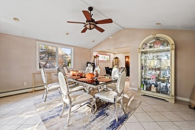 tiled dining space with baseboard heating, lofted ceiling, and ceiling fan