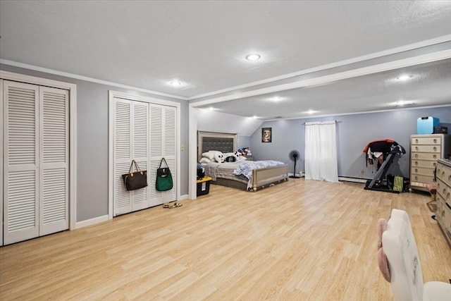 bedroom featuring lofted ceiling, multiple closets, light hardwood / wood-style flooring, ornamental molding, and baseboard heating