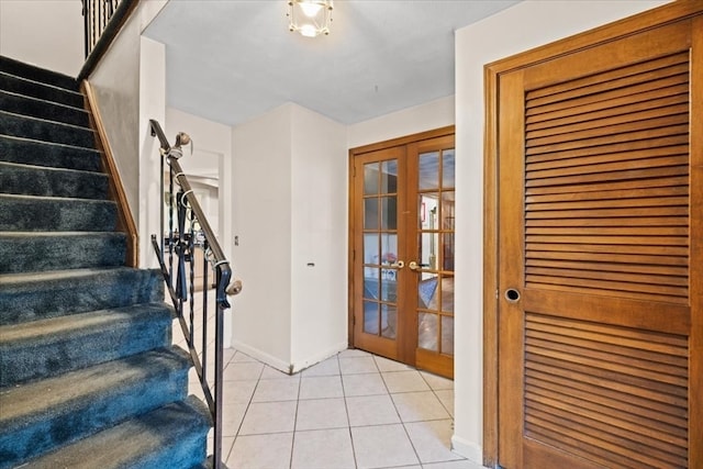 tiled entryway featuring french doors