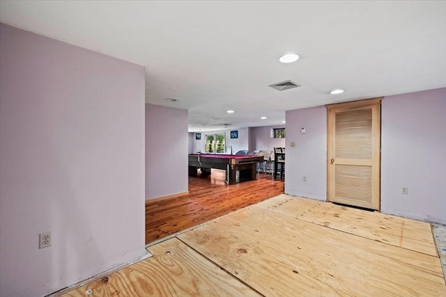 interior space featuring hardwood / wood-style floors and pool table