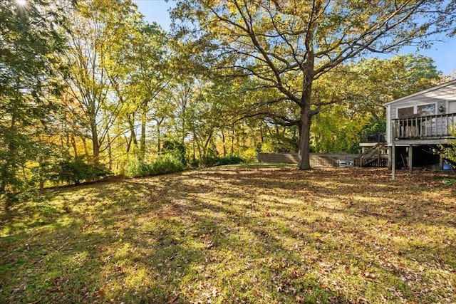 view of yard featuring a wooden deck