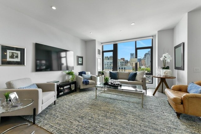 living room featuring recessed lighting and expansive windows