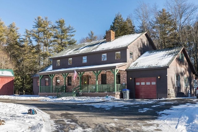 view of front of house with a garage and covered porch