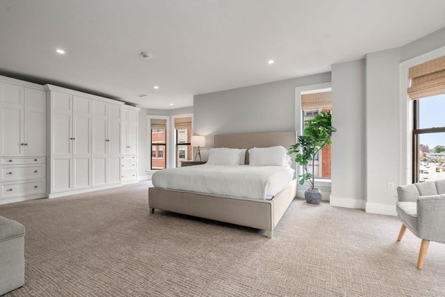 bedroom featuring recessed lighting and light carpet