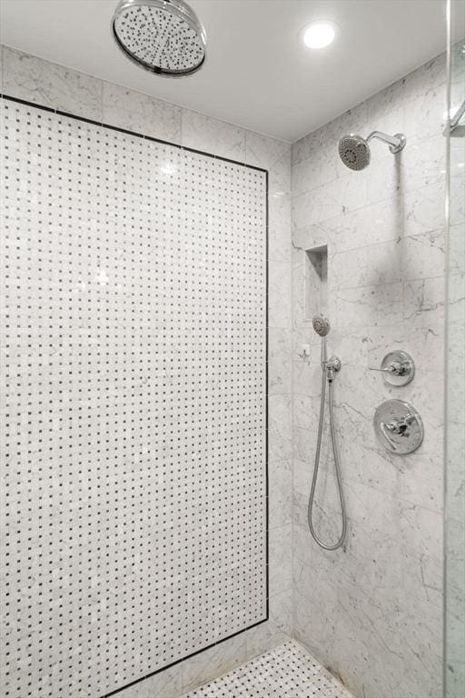 full bathroom with a tile shower