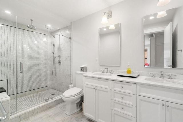 full bath featuring a stall shower, a sink, and toilet