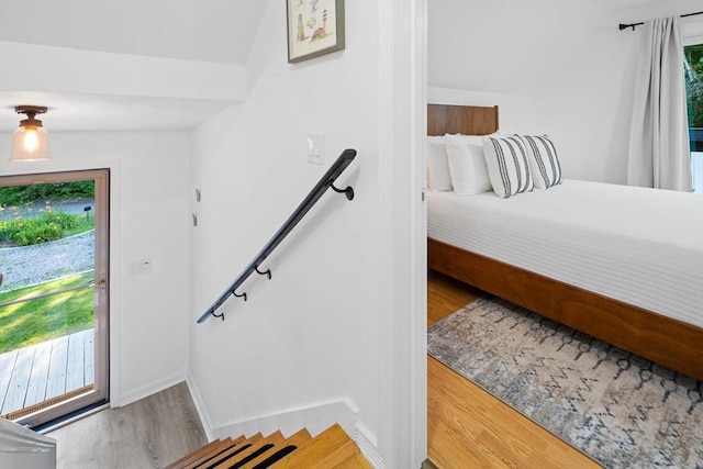 foyer with light wood-style floors and baseboards