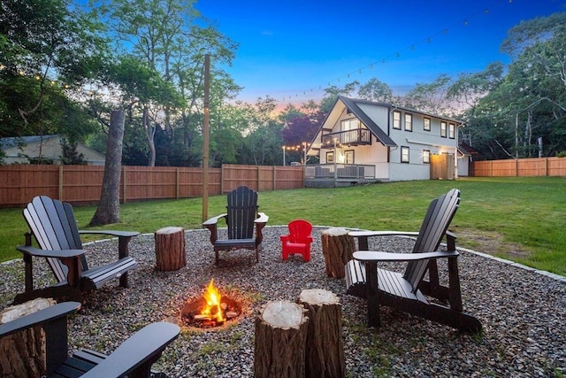 view of yard with an outdoor fire pit and a fenced backyard