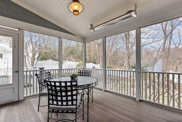 sunroom with vaulted ceiling and plenty of natural light