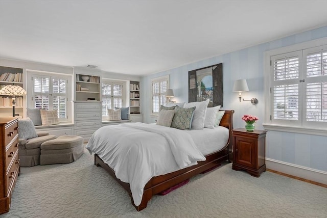 bedroom with carpet and baseboards