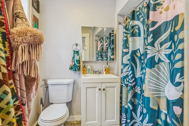 114 Chancery St, New Bedford, MA 02740 - full bathroom with toilet, vanity, a shower with shower curtain, and baseboards