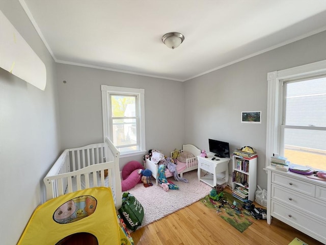 114 Chancery St, New Bedford, MA 02740 - bedroom featuring wood finished floors and ornamental molding