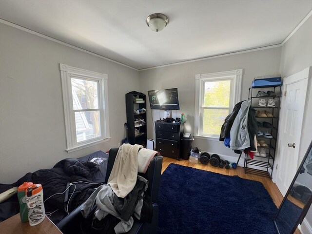 114 Chancery St, New Bedford, MA 02740 - bedroom with ornamental molding, wood finished floors, and multiple windows