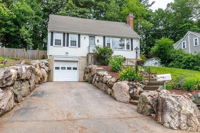 70 Fox Meadow Ln, Dedham, MA 02026 - view of front of house with driveway, a chimney, a garage, and roof with shingles