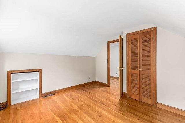 70 Fox Meadow Ln, Dedham, MA 02026 - additional living space featuring light wood-style flooring and lofted ceiling