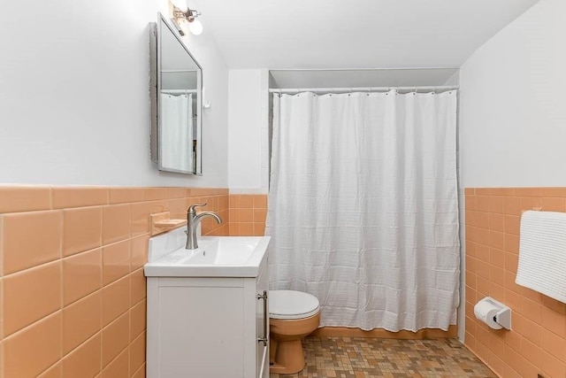 70 Fox Meadow Ln, Dedham, MA 02026 - bathroom featuring tile walls, vanity, wainscoting, and a shower with shower curtain