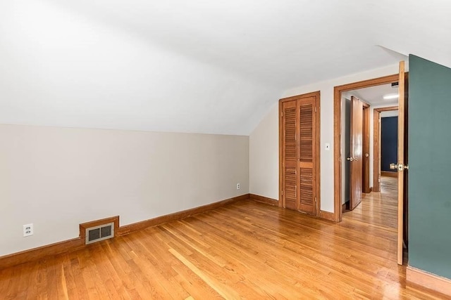 70 Fox Meadow Ln, Dedham, MA 02026 - additional living space with light wood-style flooring and lofted ceiling