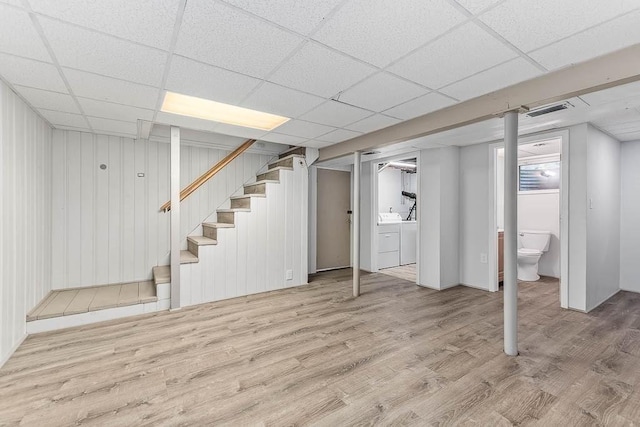 70 Fox Meadow Ln, Dedham, MA 02026 - finished basement featuring washer and clothes dryer, wood finished floors, stairway, and a paneled ceiling
