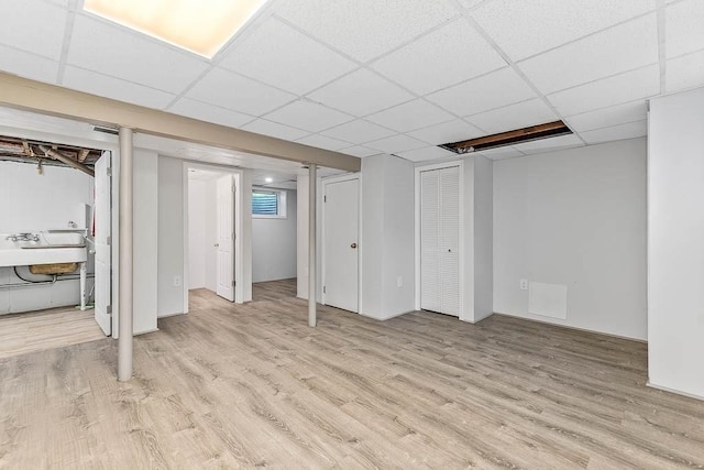 70 Fox Meadow Ln, Dedham, MA 02026 - below grade area featuring light wood-type flooring and a drop ceiling