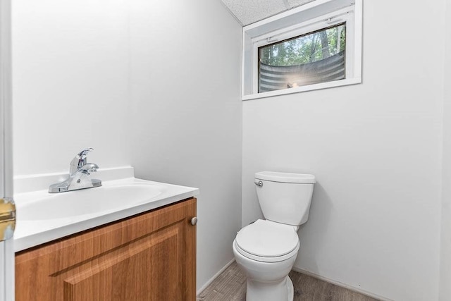 70 Fox Meadow Ln, Dedham, MA 02026 - half bathroom with vanity and wood finished floors