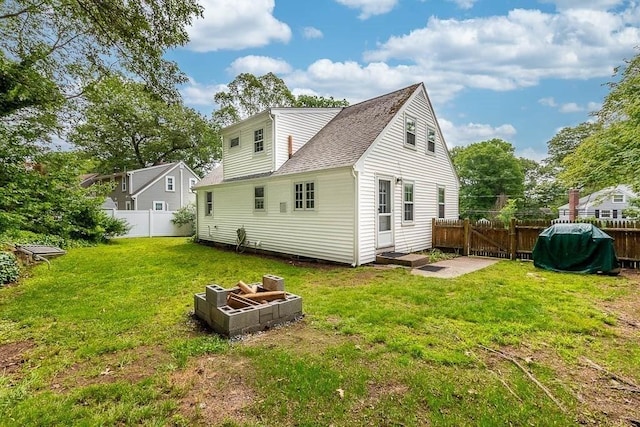 70 Fox Meadow Ln, Dedham, MA 02026 - rear view of property with a fenced backyard and roof with shingles