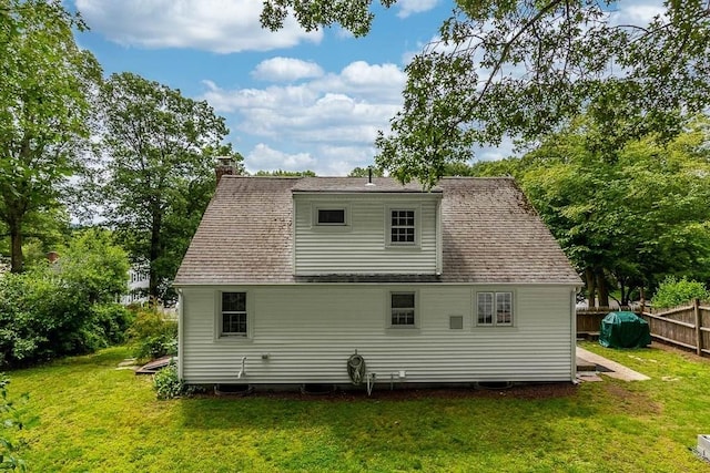 70 Fox Meadow Ln, Dedham, MA 02026 - rear view of house featuring a chimney and roof with shingles