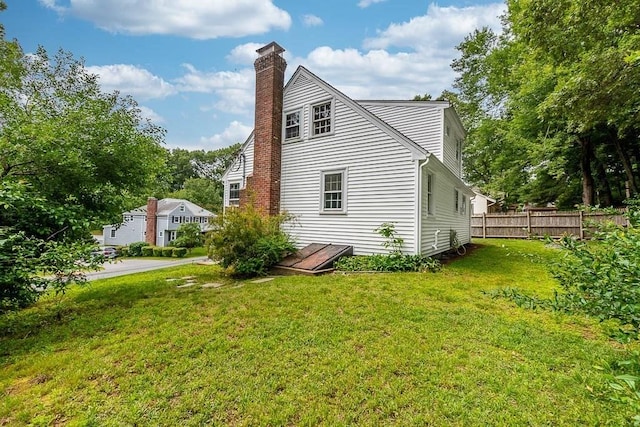 70 Fox Meadow Ln, Dedham, MA 02026 - view of side of home with a chimney