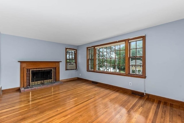 70 Fox Meadow Ln, Dedham, MA 02026 - unfurnished living room featuring light wood-type flooring and a fireplace