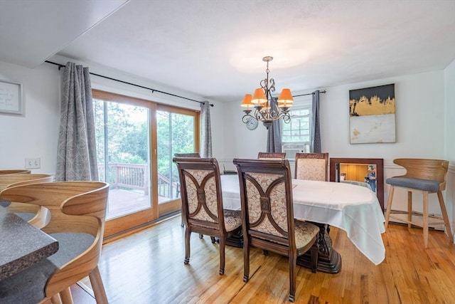 143 Davis St, Northborough, MA 01532 - dining area featuring a chandelier and light wood-style flooring