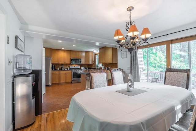 143 Davis St, Northborough, MA 01532 - dining room with a chandelier, light wood finished floors, and recessed lighting