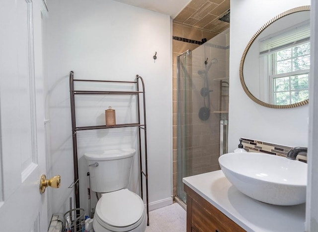 143 Davis St, Northborough, MA 01532 - bathroom with a stall shower, vanity, backsplash, and toilet