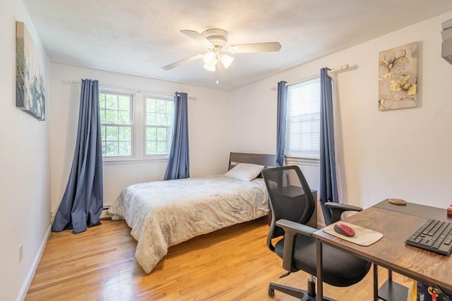 143 Davis St, Northborough, MA 01532 - bedroom featuring light wood-style flooring, a desk, baseboards, and a ceiling fan