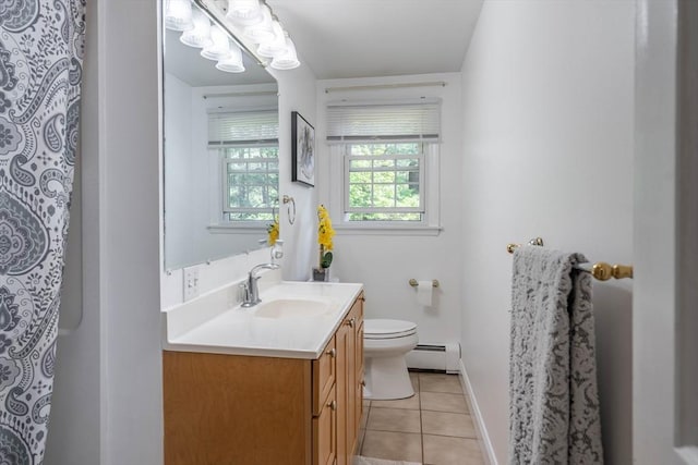 143 Davis St, Northborough, MA 01532 - bathroom featuring a baseboard heating unit, tile patterned flooring, toilet, vanity, and baseboards