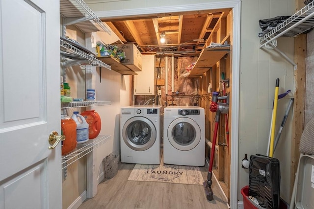 143 Davis St, Northborough, MA 01532 - clothes washing area featuring separate washer and dryer and light wood-style flooring