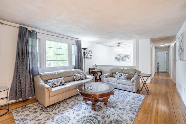 143 Davis St, Northborough, MA 01532 - living area with wood finished floors and ceiling fan